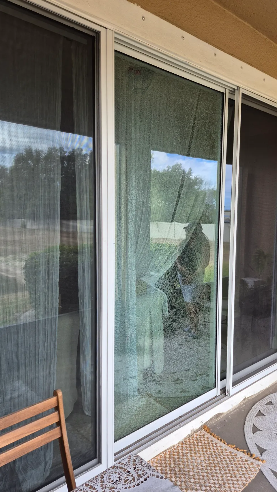 Shattered glass within a sliding-door panel