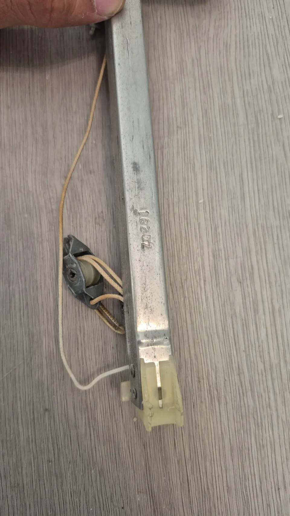 Removed window channel balance with its cord and end fittings